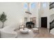 Bright living room featuring a grand piano, modern furnishings, and high ceilings at 4960 E Colonial Dr, Chandler, AZ 85249