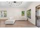 Bright living room with neutral paint, hardwood flooring, lots of natural light, and sliding doors to the patio at 4960 E Colonial Dr, Chandler, AZ 85249