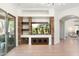 Inviting living room with built-in entertainment center featuring stone accents and open layout at 4960 E Colonial Dr, Chandler, AZ 85249