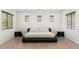 Modern bedroom with neutral decor featuring a platform bed and clean, minimalist design at 4960 E Colonial Dr, Chandler, AZ 85249