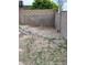 Backyard with minimal foliage and gravel and rock features along the walls at 5143 W Mountain View Rd, Glendale, AZ 85302