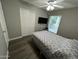 Bedroom with dark wood laminate flooring, and a ceiling fan at 5143 W Mountain View Rd, Glendale, AZ 85302