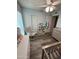 A Bedroom with a crib, dresser, rocker and neutral blue color scheme at 5143 W Mountain View Rd, Glendale, AZ 85302