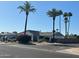 Charming single-story home with mature palm trees and a well-maintained yard at 5143 W Mountain View Rd, Glendale, AZ 85302