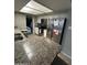 Spacious kitchen with granite countertops, white cabinets, and modern stainless steel appliances at 5143 W Mountain View Rd, Glendale, AZ 85302