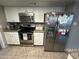 Well-lit kitchen featuring stainless steel appliances, white cabinetry, and a granite countertop at 5143 W Mountain View Rd, Glendale, AZ 85302