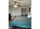 Spacious main bedroom with a ceiling fan, closet, and wood-look vinyl plank flooring at 5143 W Mountain View Rd, Glendale, AZ 85302