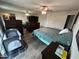 Relaxing main bedroom with a baby crib, a ceiling fan, and wood-look floors at 5143 W Mountain View Rd, Glendale, AZ 85302
