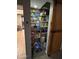 Walk-in pantry with organized shelves, offering plenty of storage space at 5143 W Mountain View Rd, Glendale, AZ 85302