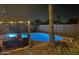 Backyard pool with lights, a gazebo, and lounge area, ideal for relaxing evenings at 5143 W Mountain View Rd, Glendale, AZ 85302