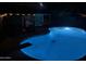 Backyard pool and shaded outdoor living area at night at 5143 W Mountain View Rd, Glendale, AZ 85302