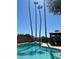 Refreshing backyard pool with tall palm trees and gazebo, creating a private retreat at 5143 W Mountain View Rd, Glendale, AZ 85302