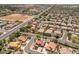 An aerial view of a home with a pool and solar panels in a suburban neighborhood at 5212 S Monte Vista St, Chandler, AZ 85249