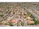 Stunning aerial view of a property in a well-planned community with mature landscaping and a private pool at 5212 S Monte Vista St, Chandler, AZ 85249