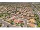An aerial view of a home with a pool and solar panels in a suburban neighborhood at 5212 S Monte Vista St, Chandler, AZ 85249
