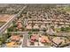 An aerial view of a home with a pool and solar panels in a suburban neighborhood at 5212 S Monte Vista St, Chandler, AZ 85249