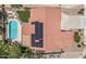 An aerial view of a home with solar panels, a pool, and a well-maintained yard at 5212 S Monte Vista St, Chandler, AZ 85249