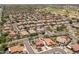 An aerial view of a home with a pool and solar panels in a suburban neighborhood at 5212 S Monte Vista St, Chandler, AZ 85249