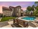 Beautifully landscaped backyard with a refreshing pool, artificial grass, and seating area at 5212 S Monte Vista St, Chandler, AZ 85249