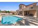 Inviting backyard featuring a refreshing swimming pool, patio, and a meticulously landscaped area at 5212 S Monte Vista St, Chandler, AZ 85249