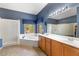 Bathroom boasts a dual sink vanity, soaking tub under a bright window, and separate shower at 5212 S Monte Vista St, Chandler, AZ 85249