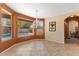 Spacious dining area with large windows overlooking the pool and backyard at 5212 S Monte Vista St, Chandler, AZ 85249