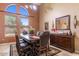Elegant dining room with high ceilings, large windows, and a stylish dining set at 5212 S Monte Vista St, Chandler, AZ 85249