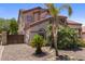 Stylish two-story home with a private driveway, lush landscaping, and a detached garage at 5212 S Monte Vista St, Chandler, AZ 85249