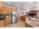 Spacious kitchen with granite counters, stainless steel appliances and tile flooring at 5212 S Monte Vista St, Chandler, AZ 85249