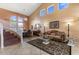 Bright and airy living room with soaring ceilings, large windows, and stylish decor at 5212 S Monte Vista St, Chandler, AZ 85249