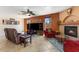 Cozy living room with fireplace, large TV, and comfortable seating at 5212 S Monte Vista St, Chandler, AZ 85249