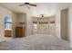 Spacious living room with neutral walls, carpet flooring, ceiling fans, and plenty of sunlight at 5212 S Monte Vista St, Chandler, AZ 85249