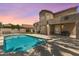 Inviting backyard with a sparkling pool, covered patio, and desert landscaping; perfect for outdoor living at 5212 S Monte Vista St, Chandler, AZ 85249