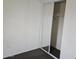 A bedroom featuring a built in closet with sliding doors and neutral gray carpet at 5446 W Sheena Dr, Glendale, AZ 85306