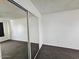 Cozy bedroom with carpet and mirrored closet doors at 5446 W Sheena Dr, Glendale, AZ 85306
