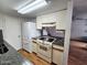 Efficient kitchen featuring white appliances, granite countertops, and ample cabinet space at 5446 W Sheena Dr, Glendale, AZ 85306