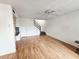Bright living room with laminate floors, ceiling fan, and staircase at 5446 W Sheena Dr, Glendale, AZ 85306