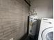 A water heater is visible in the laundry area with a brick wall behind it at 5446 W Sheena Dr, Glendale, AZ 85306