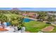 Scenic aerial view showcasing the golf course, mountain views, and pristine lake creating a tranquil ambiance at 6131 N 28Th Pl, Phoenix, AZ 85016