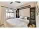 Cozy bedroom with built-in shelving and a comfortable bed with lots of pillows at 6131 N 28Th Pl, Phoenix, AZ 85016