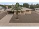 View of single-story home showcasing the well-maintained landscape, neutral tones, and convenient carport at 6217 E Dodge St, Mesa, AZ 85205