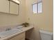 Clean and simple bathroom featuring neutral tones, and a minimalist design at 6217 E Dodge St, Mesa, AZ 85205