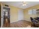 Bedroom with laminate floors, closet, desk, and natural light at 6217 E Dodge St, Mesa, AZ 85205