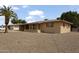 Charming single-story home with desert landscaping and attached carport at 6217 E Dodge St, Mesa, AZ 85205