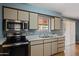 Kitchen featuring tile countertops and a stainless steel oven, great for cooking and entertaining at 6217 E Dodge St, Mesa, AZ 85205