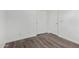 A spacious bedroom with hard wood flooring, base trim, and neutral paint at 6359 S Forest Ave, Gilbert, AZ 85298