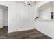 Bright dining area with modern chandelier and view into kitchen at 6359 S Forest Ave, Gilbert, AZ 85298