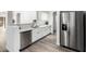 Modern kitchen with stainless steel appliances and white cabinets at 6359 S Forest Ave, Gilbert, AZ 85298