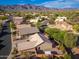 Stunning aerial view of a residential area showcasing lush landscaping and mountain views at 6939 S Red Hills Rd, Gold Canyon, AZ 85118