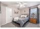 Cozy bedroom with a metal bed frame, soft grey linens, and a vintage dresser at 6939 S Red Hills Rd, Gold Canyon, AZ 85118